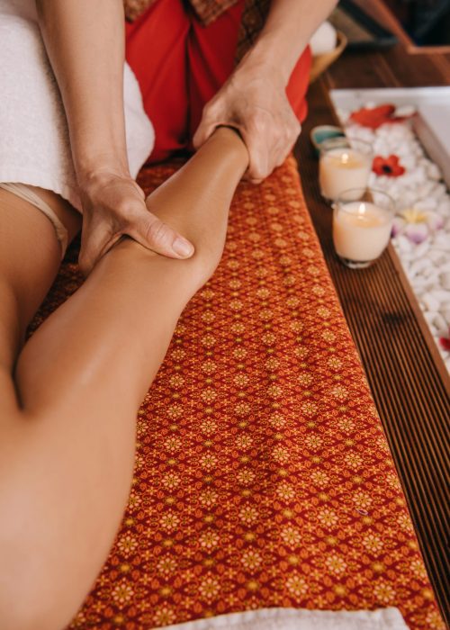 Client receiving leg massage therapy at Well Being Massage – contact us to book your session today.